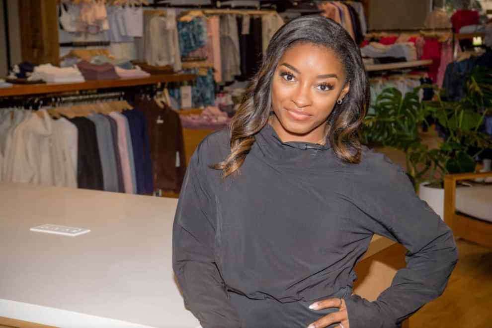 HOUSTON, TEXAS - JANUARY 22: Simone Biles during the AthletaWell Gold Medal Groove at Athleta Town & Country Village on January 22, 2023 in Houston, Texas.