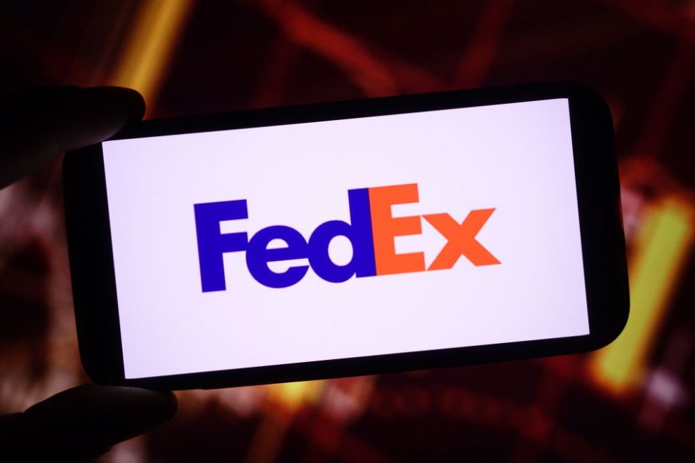 POLAND - 2024/12/01: In this photo illustration, the FedEx company logo is seen displayed on a smartphone screen.