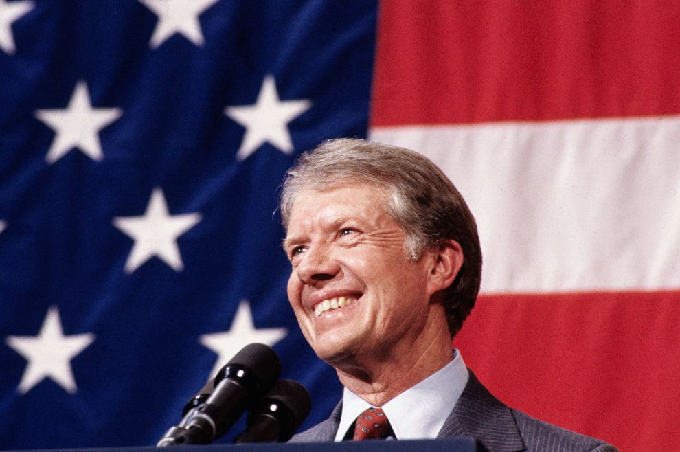 (Original Caption) 3/24/1979-Elk City, Oklahoma: Closeup of President Jimmy Carter, addressing a town meeting. American flag in background.
