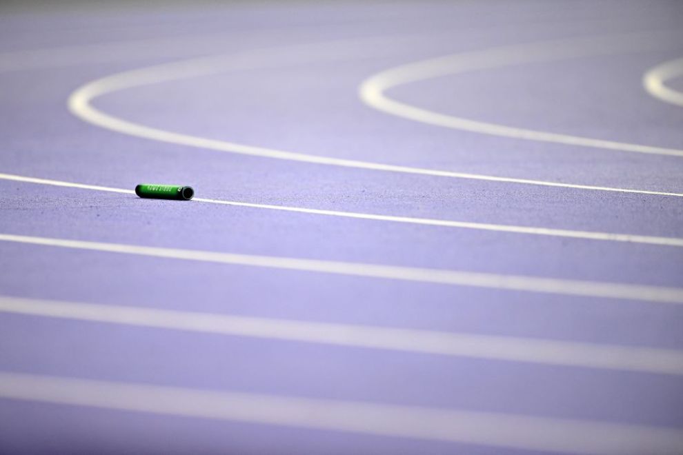The baton of Jamaica lies on the track after it was dropped during the women's 4x400m relay final of the athletics event at the Paris 2024 Olympic Games at Stade de France in Saint-Denis, north of Paris, on August 10, 2024.