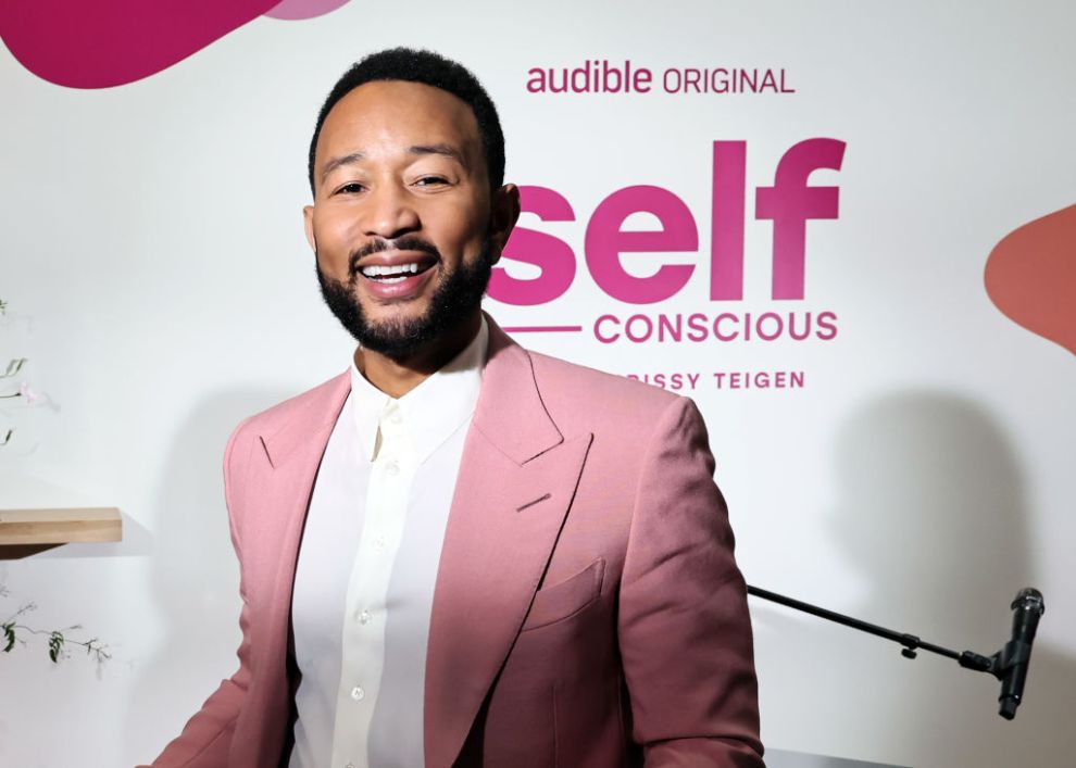 LOS ANGELES, CALIFORNIA - MARCH 14: John Legend poses as Audible celebrates new original podcast "Self-Conscious with Chrissy Teigen" with special event at House of Good on March 14, 2025 in Los Angeles, California.