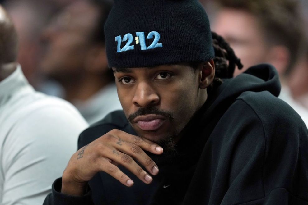 PORTLAND, OREGON - MARCH 19: Ja Morant #12 of the Memphis Grizzlies watches from the bench during the first half against the Portland Trail Blazers at Moda Center on March 19, 2025 in Portland, Oregon. NOTE TO USER: User expressly acknowledges and agrees that, by downloading and or using this photograph, User is consenting to the terms and conditions of the Getty Images License Agreement.