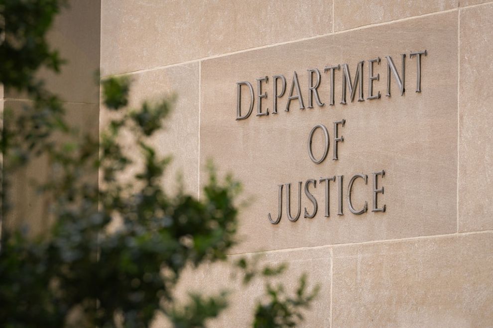 WASHINGTON, DC - APRIL 30: A sign marks the location of the U.S. Department of Justice (DOJ) headquarters building on April 30, 2025, in Washington, DC.