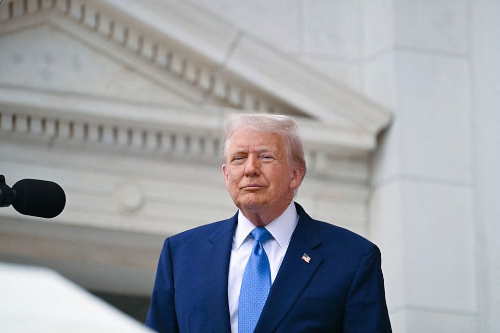 US President Donald Trump arrives to deliver remarks at the National Memorial Day Observance at the Memorial Amphitheatre in Arlington National Cemetery in Arlington, Virginia, on May 26, 2025.