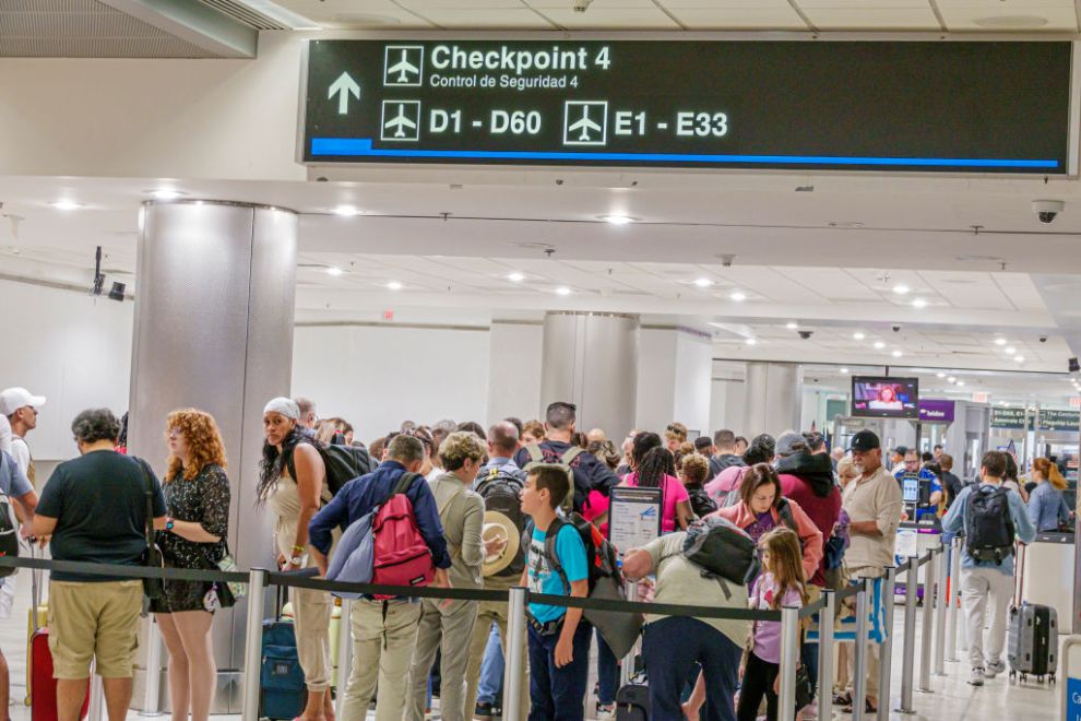 Miami, Florida, Miami International Airport, crowds of people security screening TSA checkpoint, line.