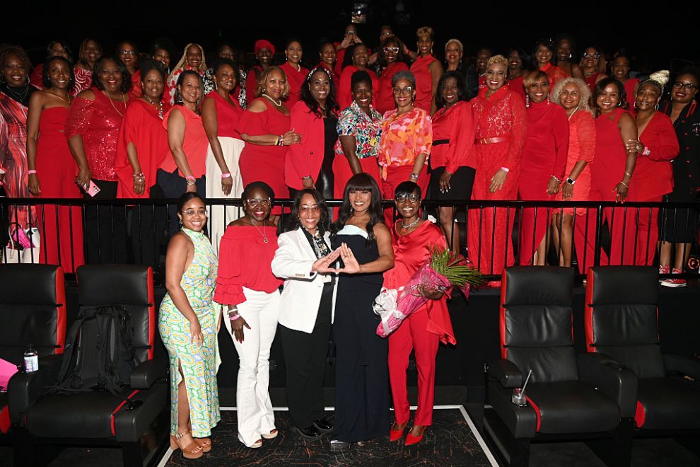 ATLANTA, GEORGIA - MAY 21: Mo Ivory and Angela Bassett pose with members of Delta Sigma Theta Sorority, Incorporated attend the "Mission Impossible – The Final Reckoning" Atlanta Special Screening with Angela Bassett at Regal Atlantic Station on May 21, 2025, in Atlanta, Georgia.